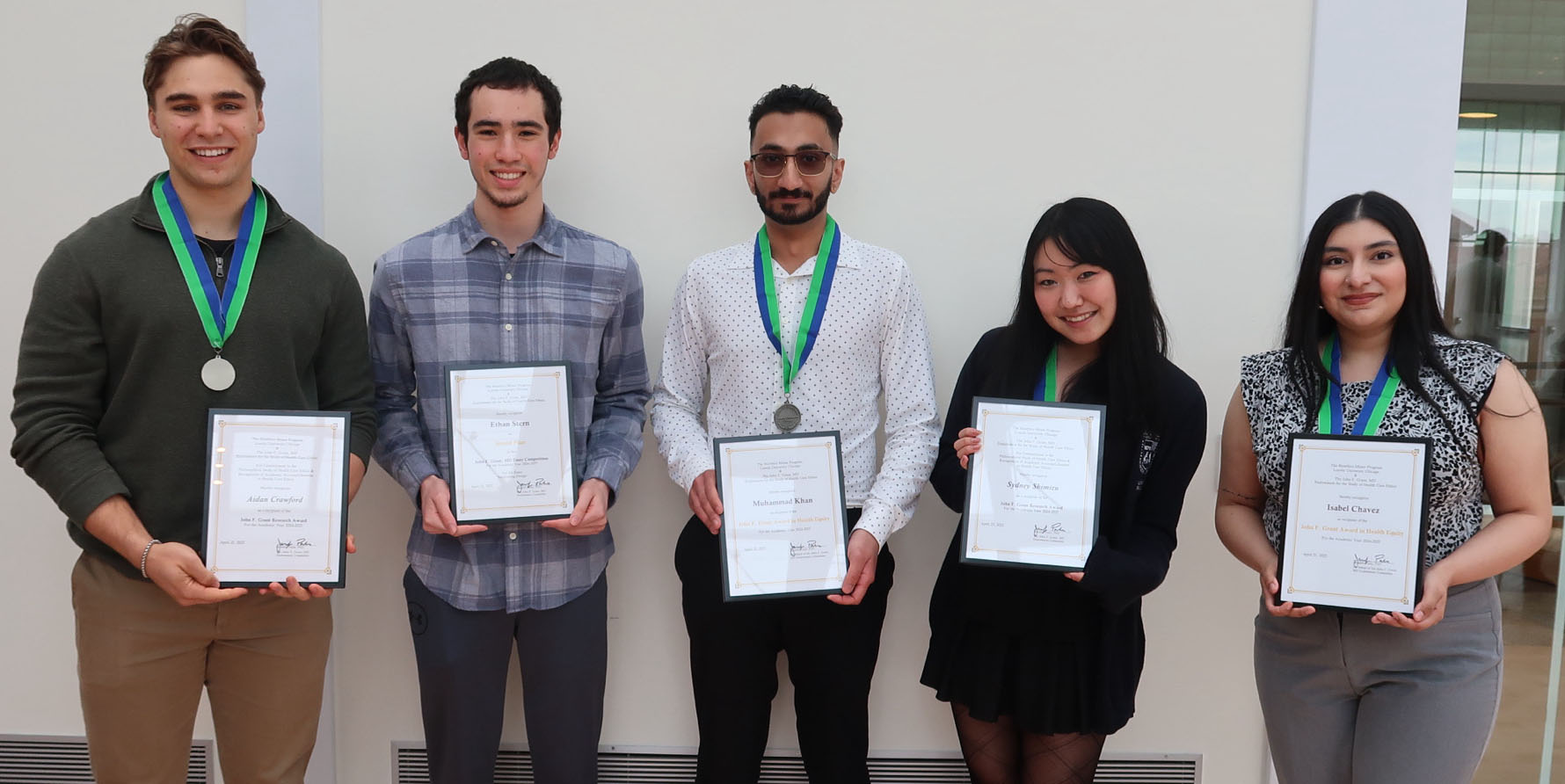 Bioethics award winners pose with their certificates
